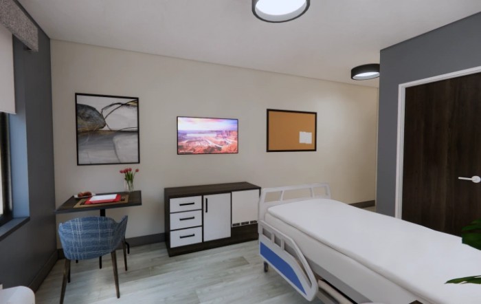 Modern hospital room with a bed and television.