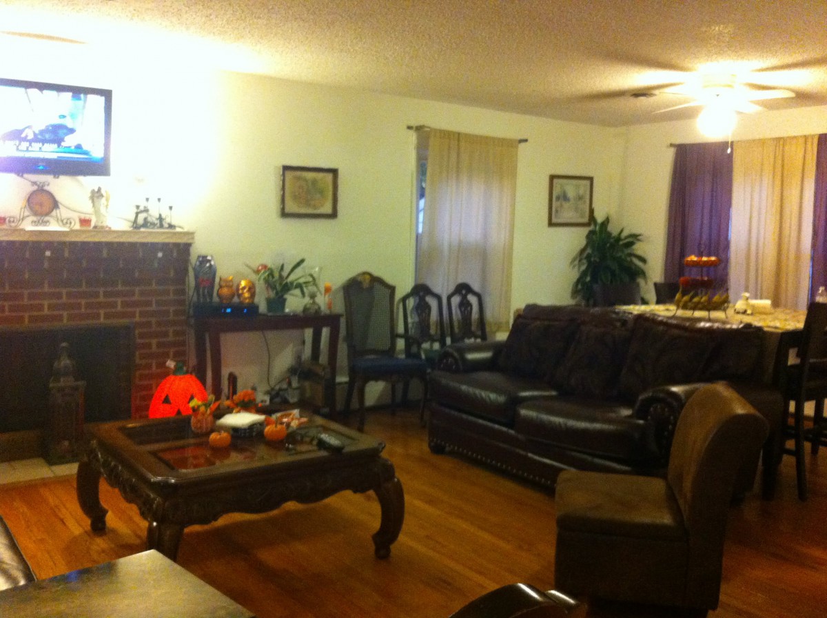 Cozy living room with a fireplace and comfortable seating.