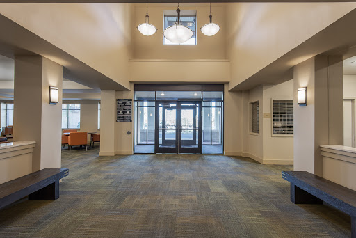 A spacious and well-lit lobby area featuring a modern entrance.