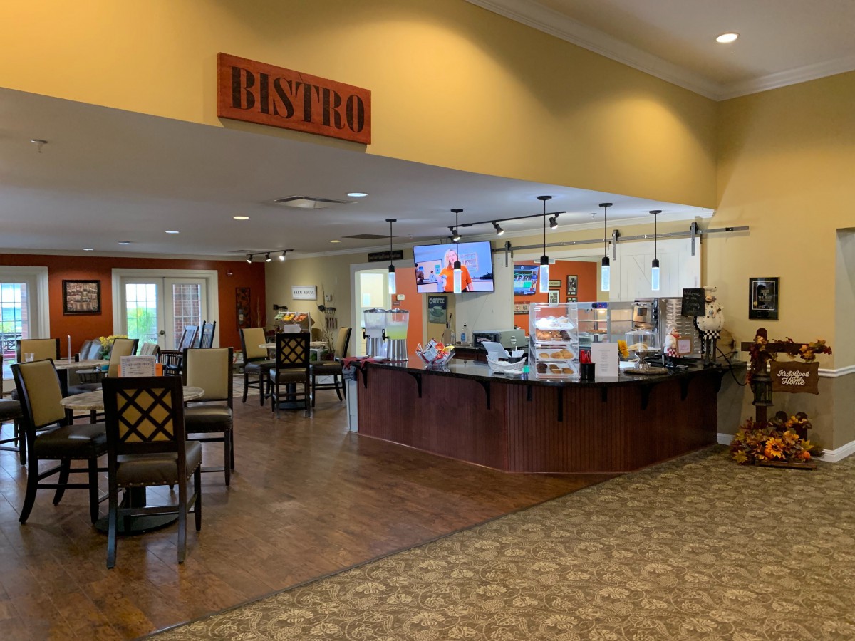 An inviting bistro interior with a counter and seating area.