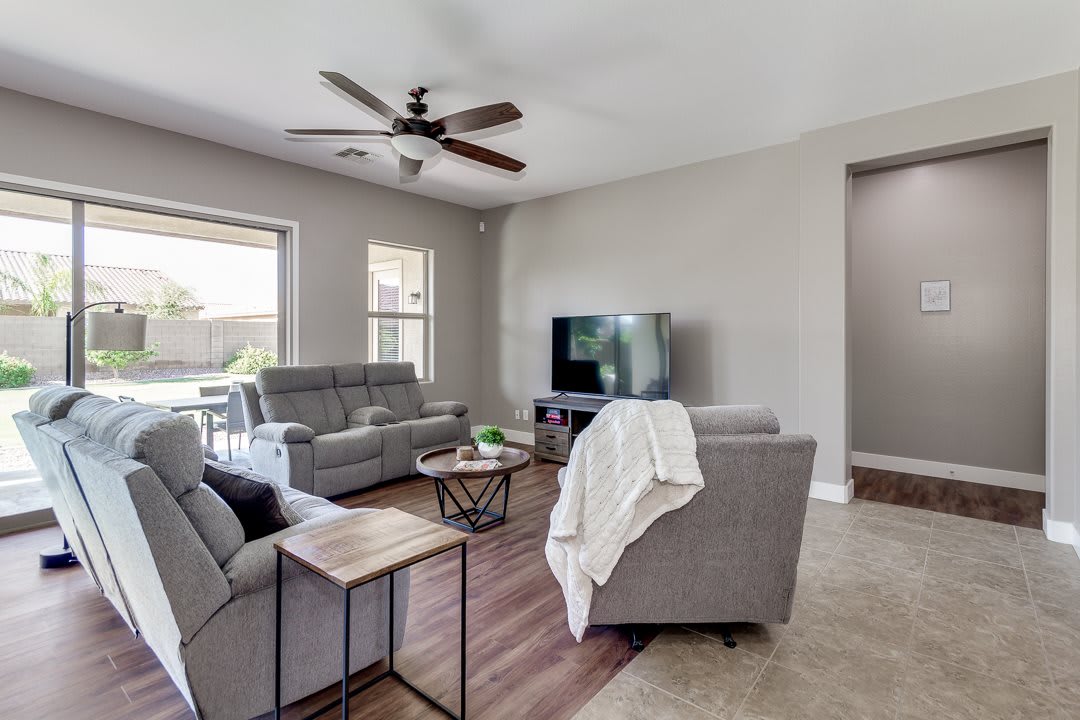 A modern living room with comfortable sofas, a television, and stylish decor.