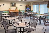 An inviting cafe interior with several tables and chairs arranged for guests.
