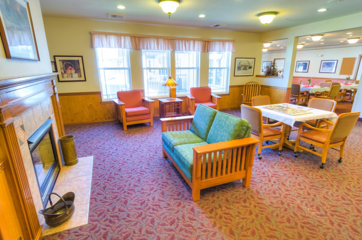 A cozy living room with comfortable seating and warm lighting.