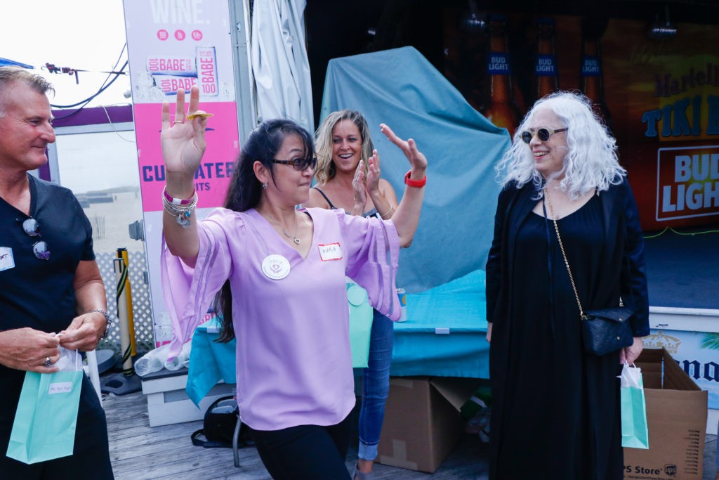A lively outdoor celebration with people enjoying themselves.