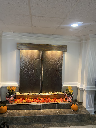 A stylish indoor water feature adorned with seasonal decorations, creating a serene atmosphere.