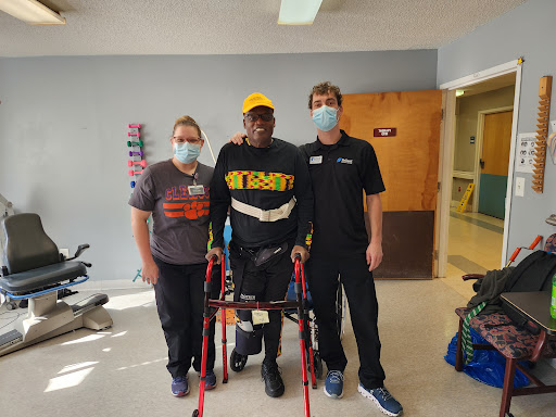 A moment of progress in rehabilitation, showcasing dedication and support.