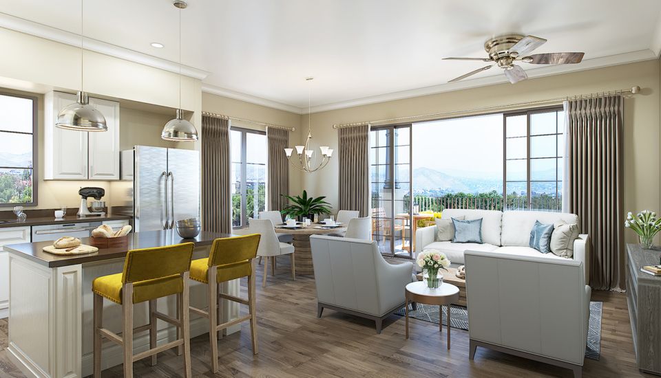 A modern open-concept living space featuring a dining area, kitchen, and cozy seating with ample natural light.