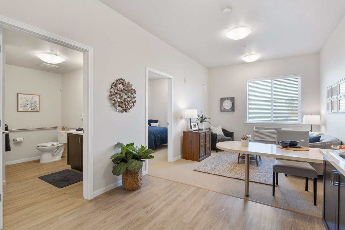 A modern and minimalist living space with bright lighting and stylish decor.