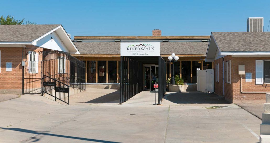 The entrance of a building with a sign reading 'Ravenna, NE'.