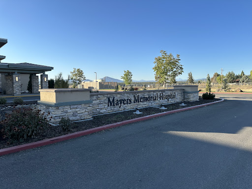 Entrance to Myrtles Memorial Hospital with a clear sky in the background.