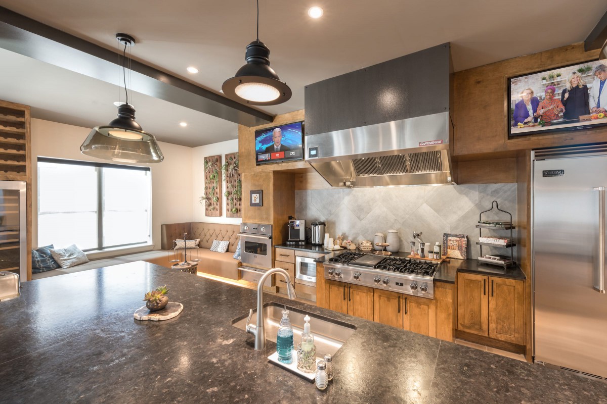 A modern kitchen with sleek appliances and a spacious countertop.
