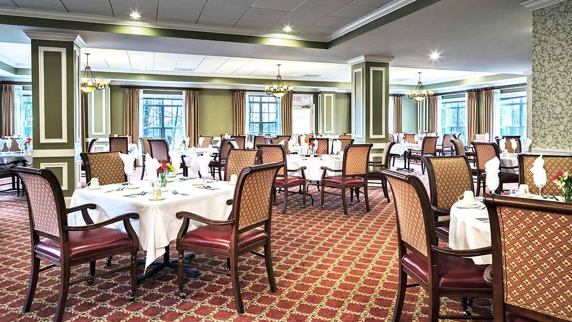 Elegant dining area with neatly arranged tables and chairs.