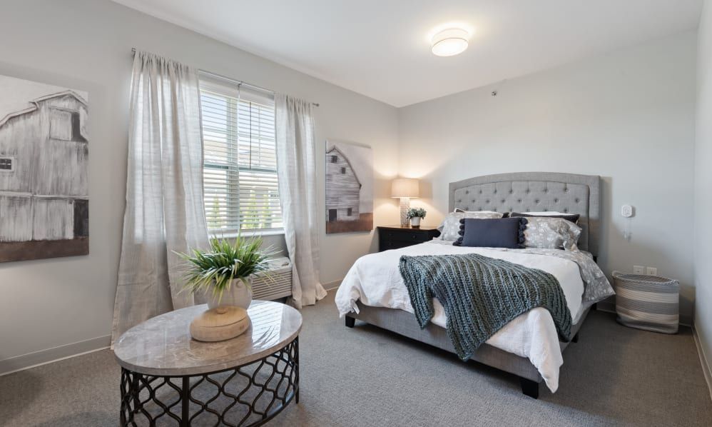 A modern and tastefully decorated bedroom with a large bed, bedside tables, and stylish decor.