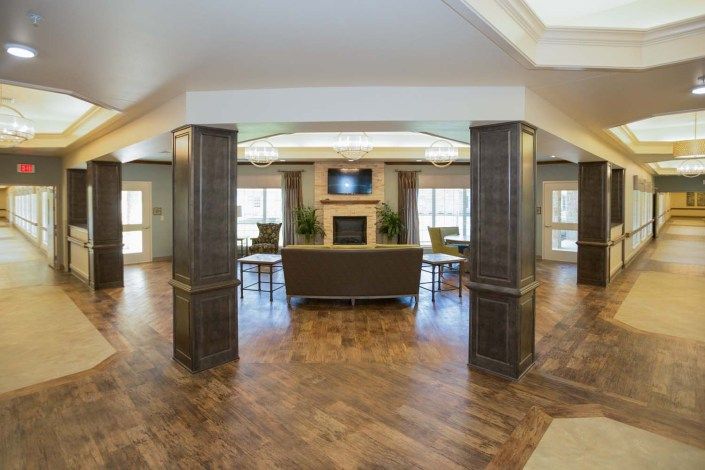 A modern lobby with elegant columns and cozy seating area.
