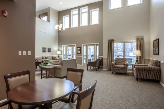 A modern and spacious living room with comfortable seating and elegant decor.