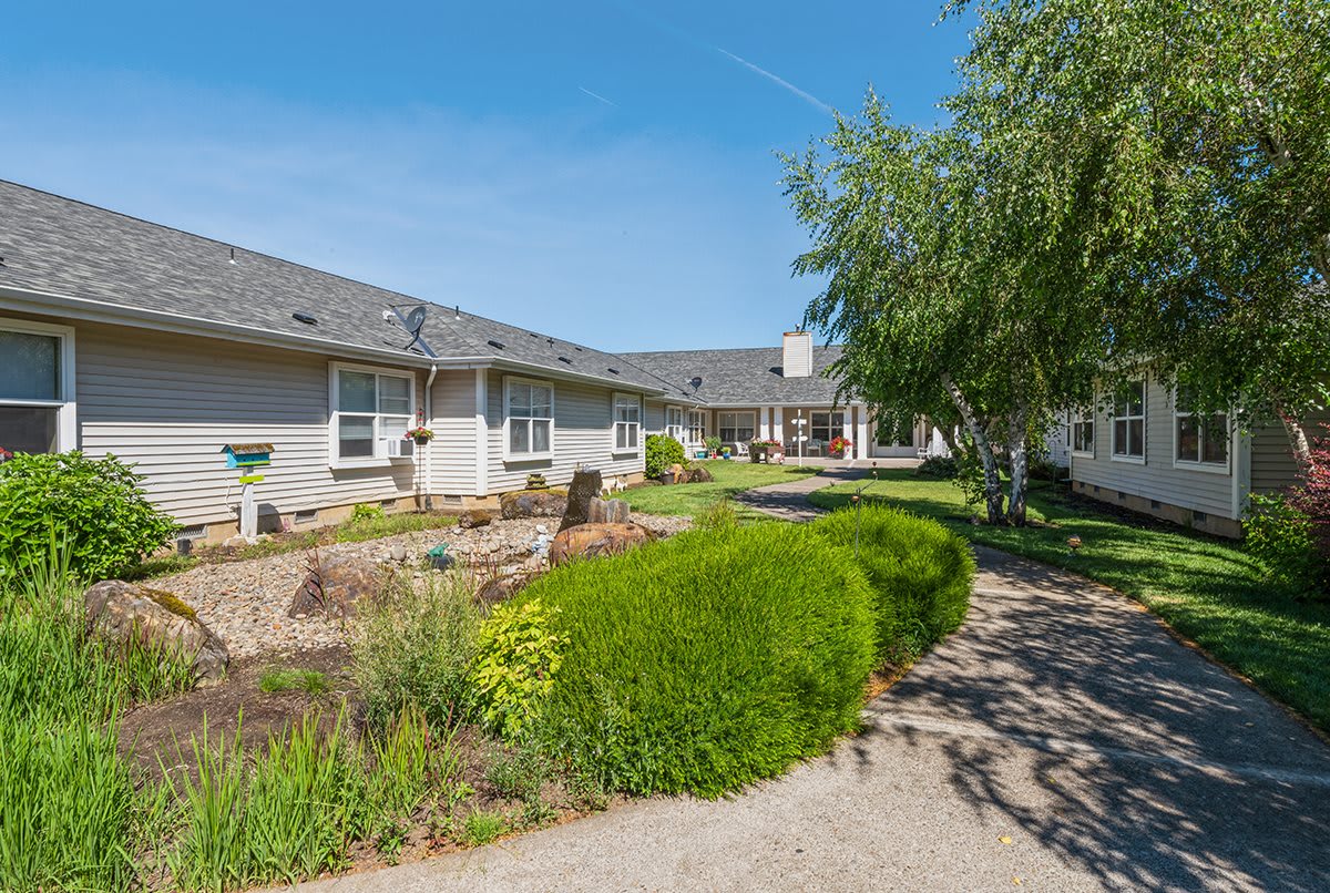 A serene courtyard with well-maintained landscaping on a sunny day.