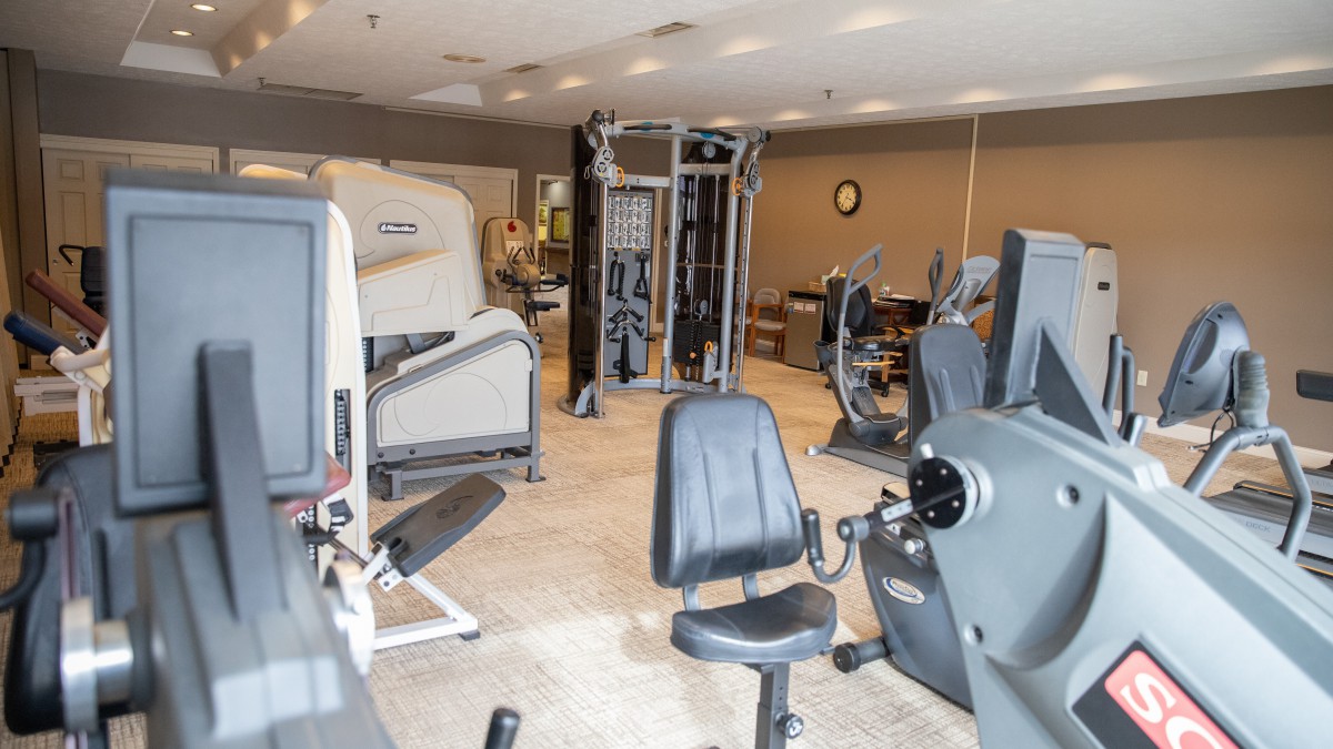 A modern gym equipped with various exercise machines for a comprehensive workout.