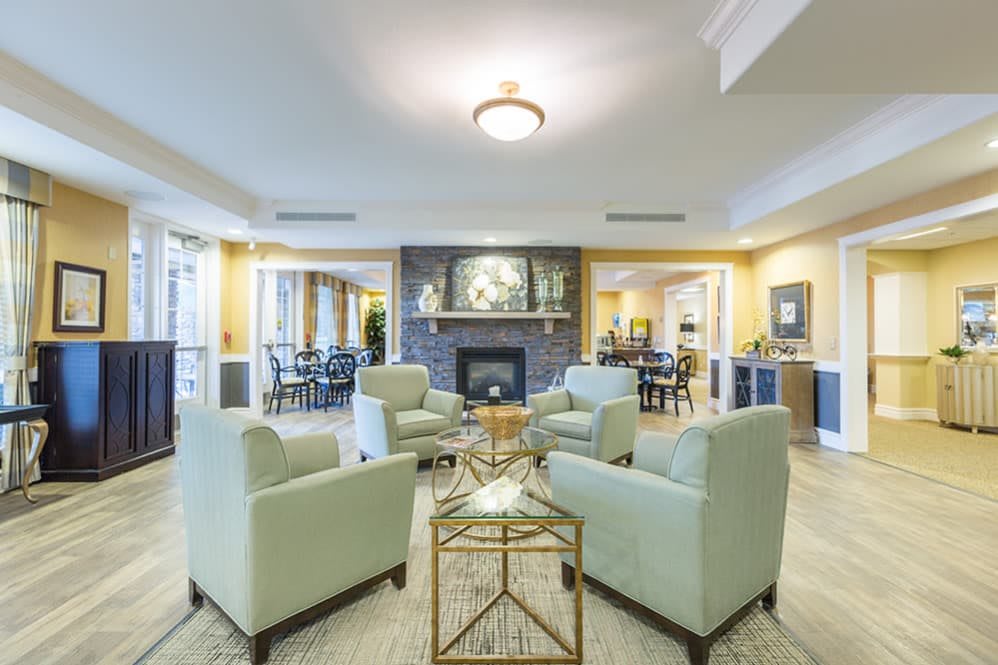 A modern living room with a fireplace and comfortable seating area.
