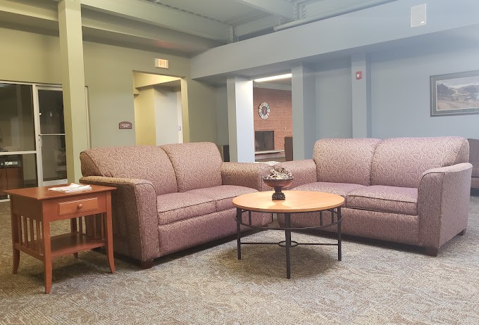 A comfortable seating area featuring two sofas and a coffee table in a modern living room setting.