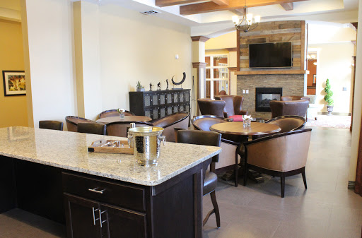 A cozy and modern living room featuring a fireplace, comfortable seating, and an inviting dining area.