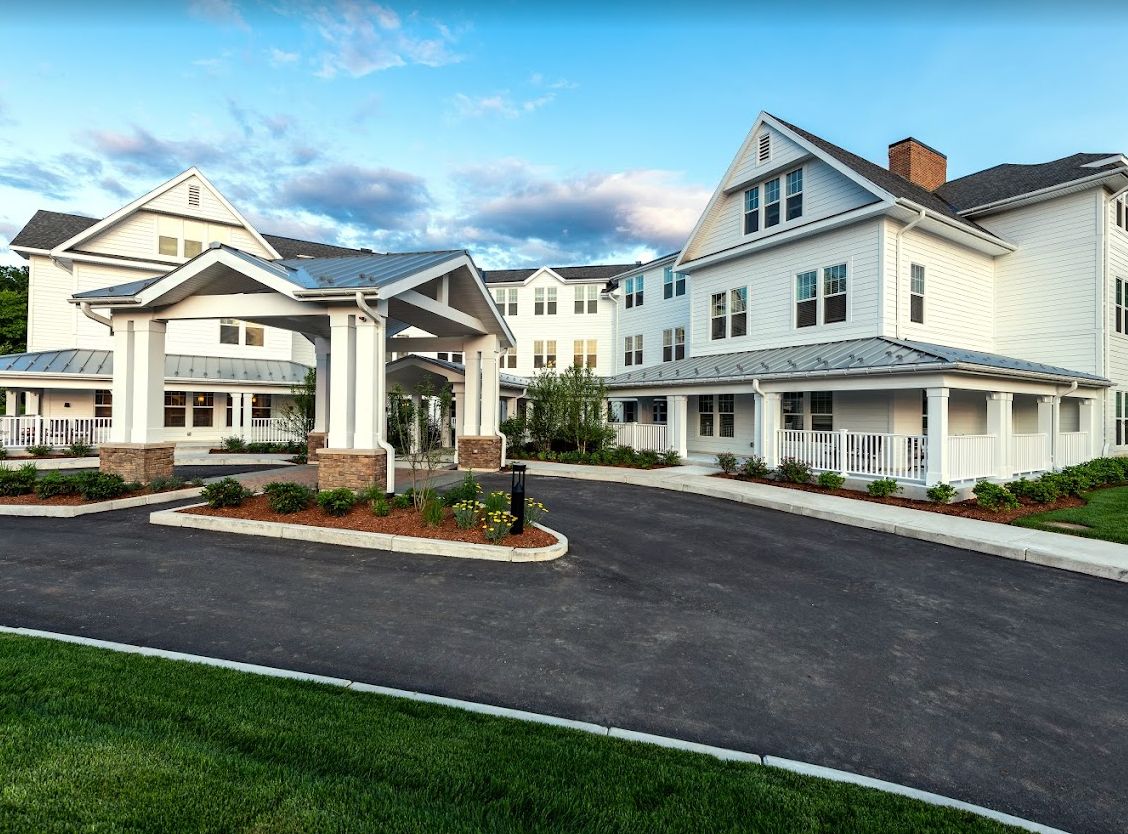 A large residential building with a welcoming entrance and driveway.