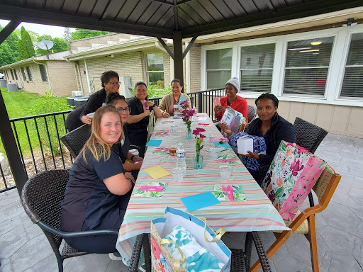 A joyful gathering of friends enjoying a lovely day outdoors.