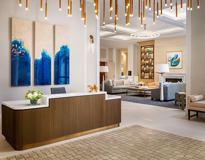 A modern and luxurious hotel lobby with elegant decor and contemporary artwork.