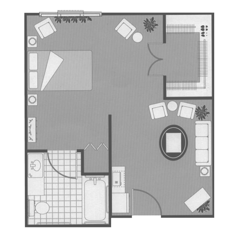 A simple floor plan of a one-bedroom apartment showing the layout of the living room, kitchen, and bathroom.