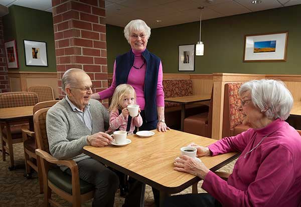 A family enjoying a visit to a coffee shop, sharing warm moments together.