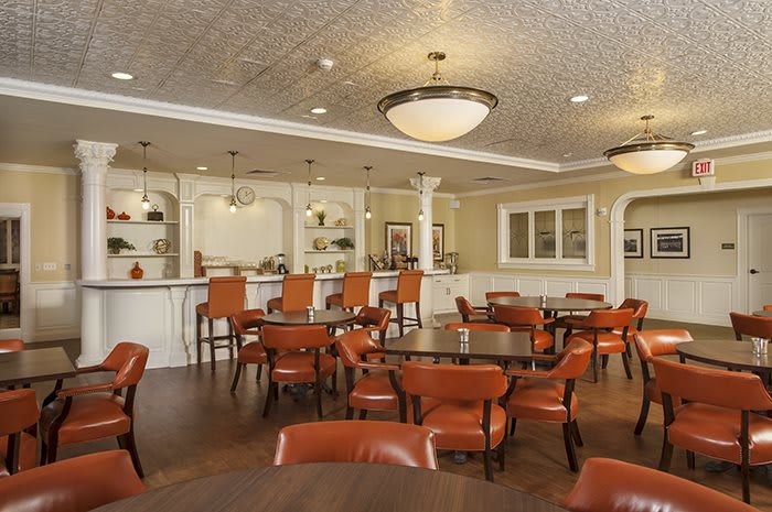 Elegant restaurant interior with bar and seating area.
