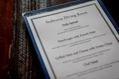 A close-up of a restaurant menu displaying daily specials.