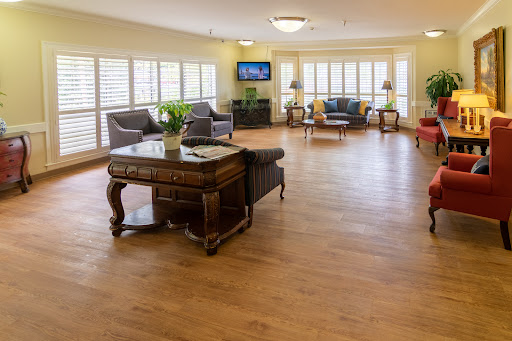 A bright and inviting living room space featuring comfortable seating and ample natural light.