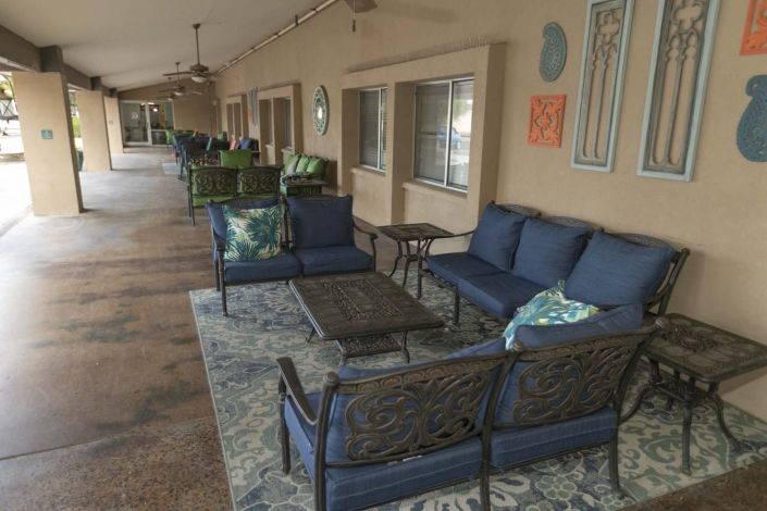 An inviting patio area with comfortable outdoor seating and decor.