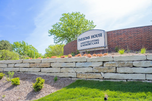 Entrance sign of Parsons House, an assisted living and memory care facility, surrounded by a well-maintained landscape.
