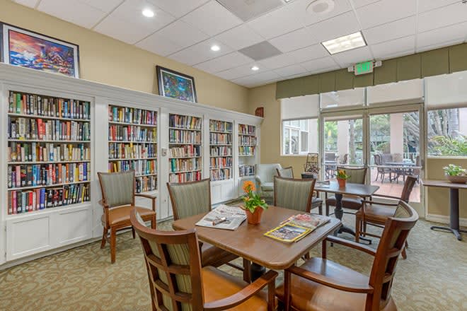 A cozy library with bookshelves and a comfortable reading area.