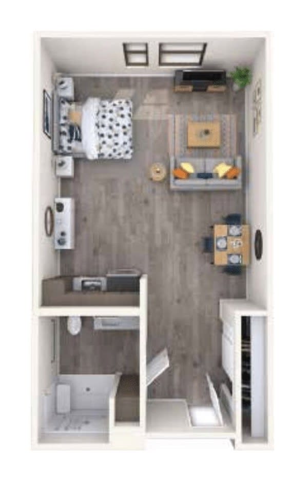 A top-down view of a studio apartment floor plan featuring a cozy living area, kitchen, and bedroom.