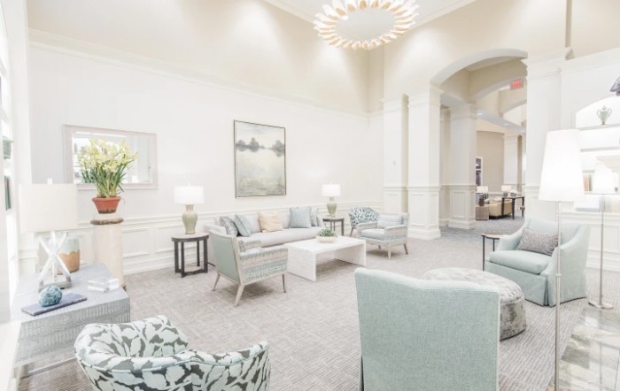 A spacious, modern lobby with comfortable seating and elegant decor.