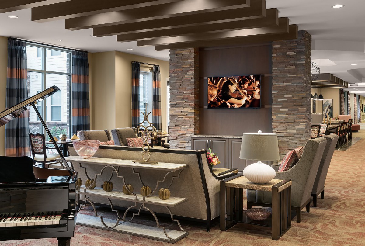 A modern and luxurious living room with elegant furniture and a cozy ambiance.