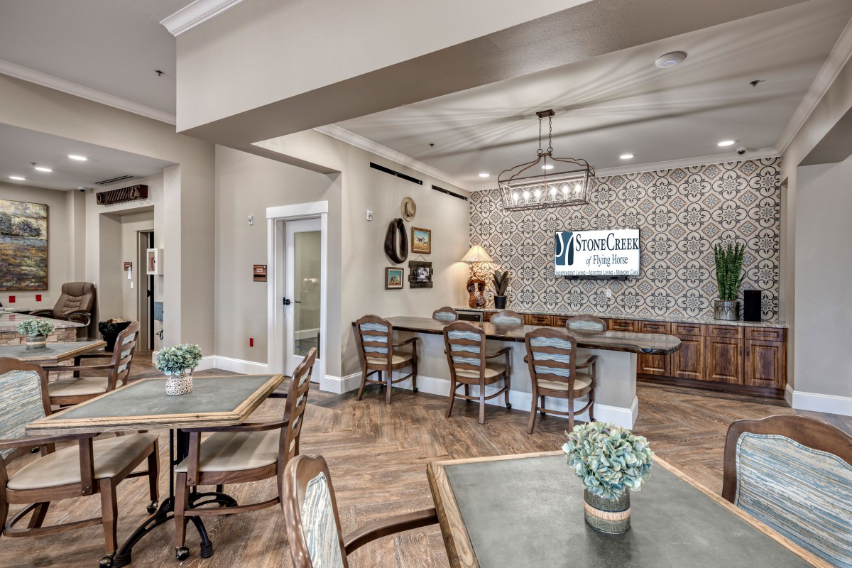 A modern living and dining space with elegant decor and comfortable seating.