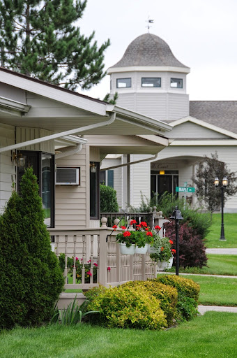 A peaceful residential area featuring well-maintained gardens and inviting architecture.