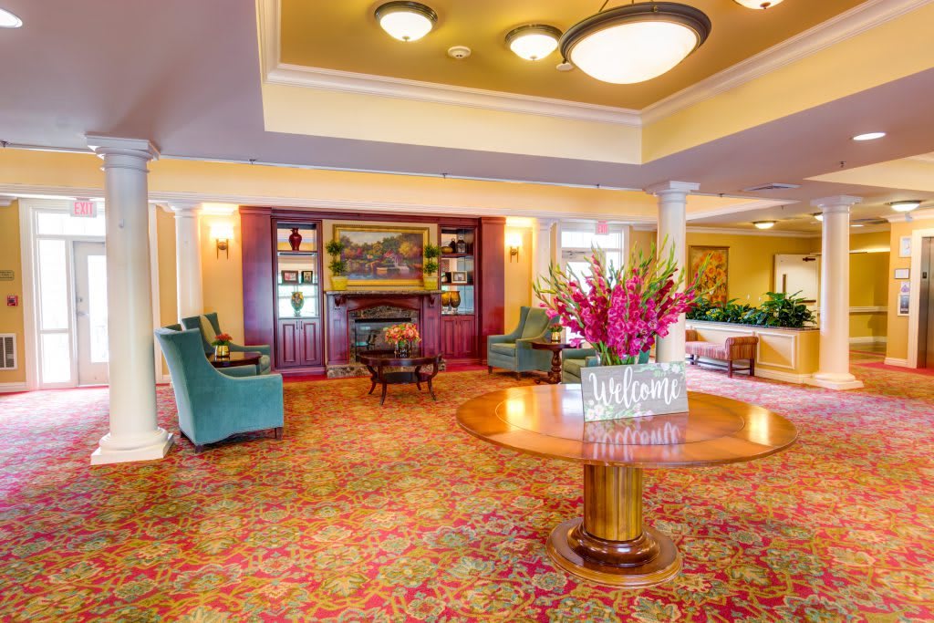 Elegant hotel lobby with colorful decor and comfortable seating.
