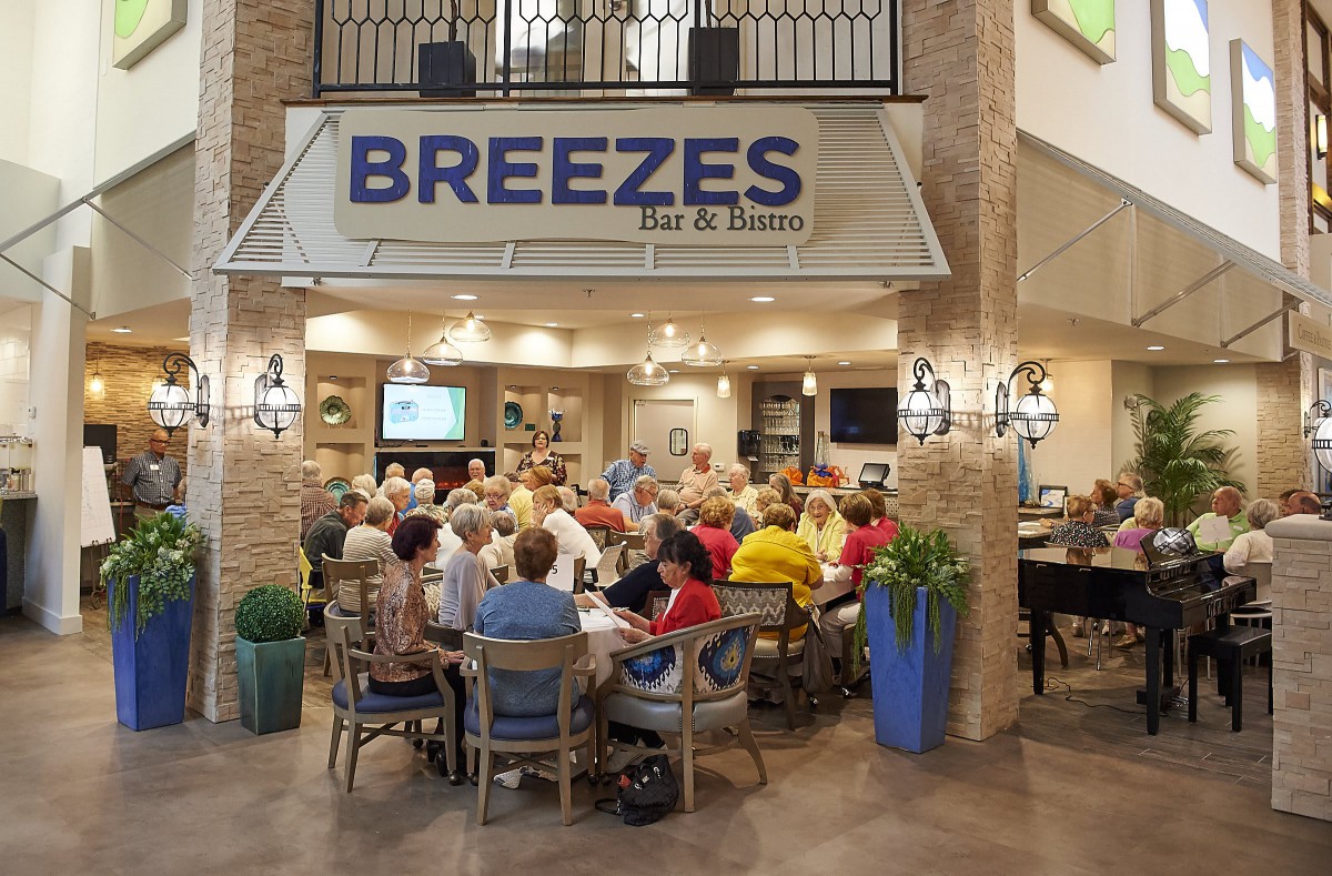 A group of people socializing at Breezes Bar & Bistro.