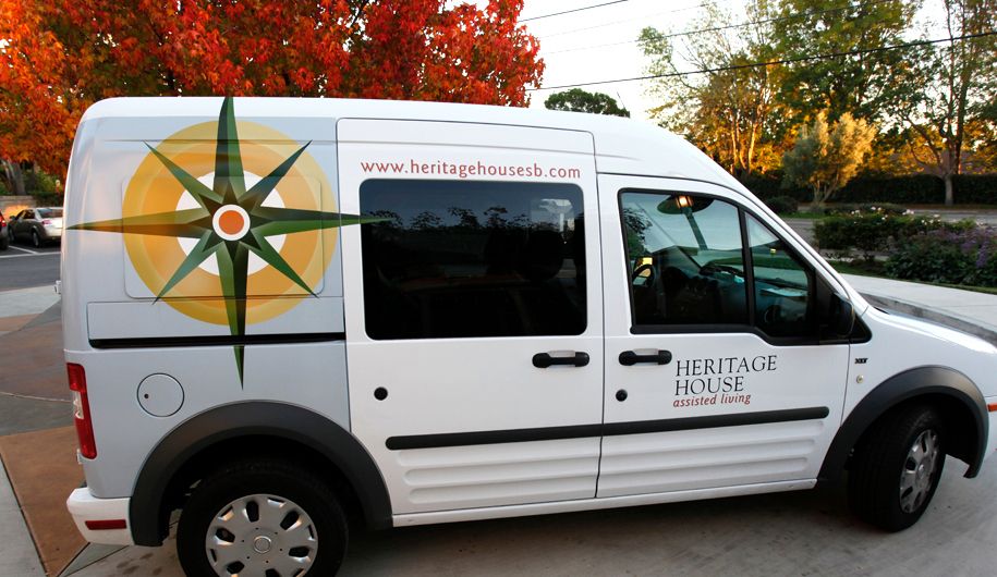 A business van with a company logo and website displayed on its side.