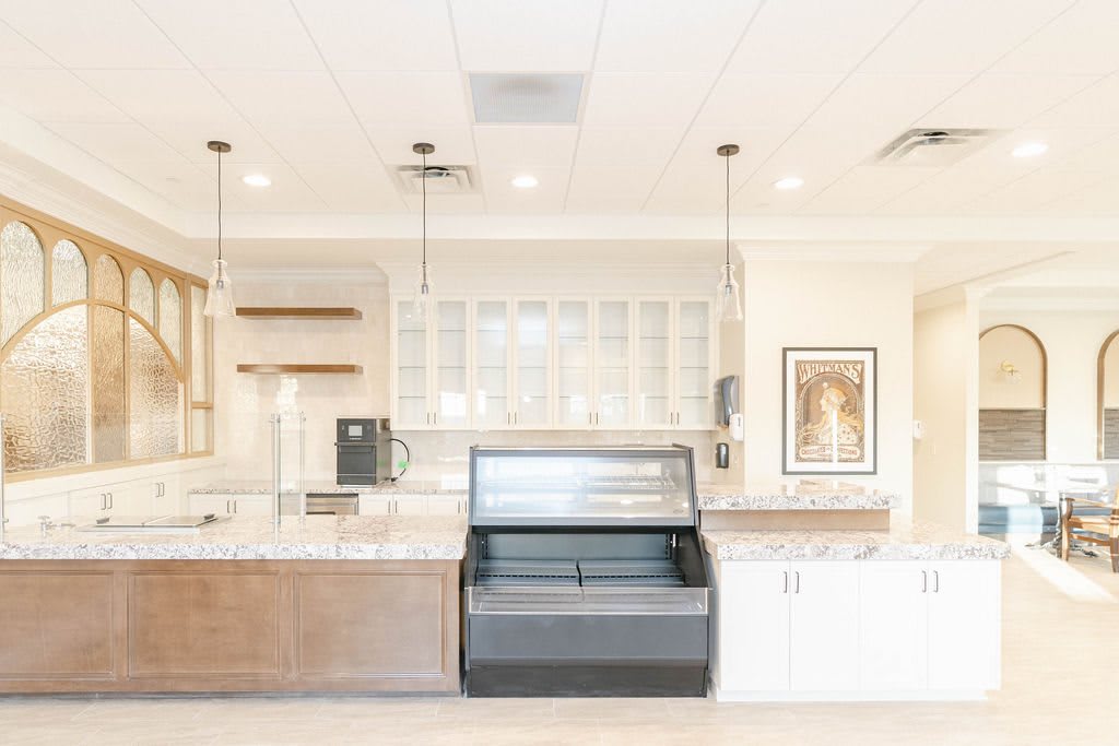 A modern kitchen interior with sleek appliances and stylish lighting.