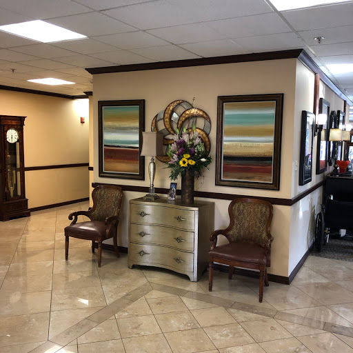 A stylish lobby featuring modern decor, comfortable seating, and colorful artwork.