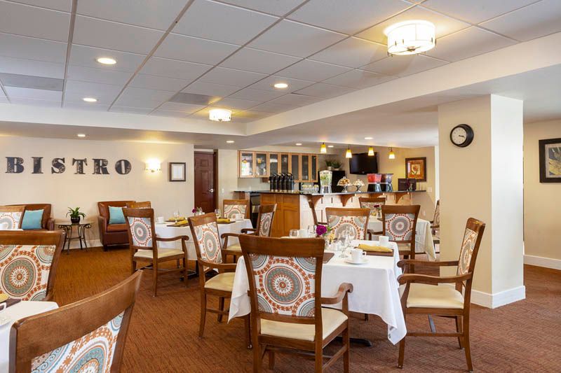A cozy restaurant dining area with neatly arranged tables and chairs.