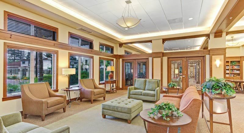 A spacious lounge area with comfortable seating and ample natural light.