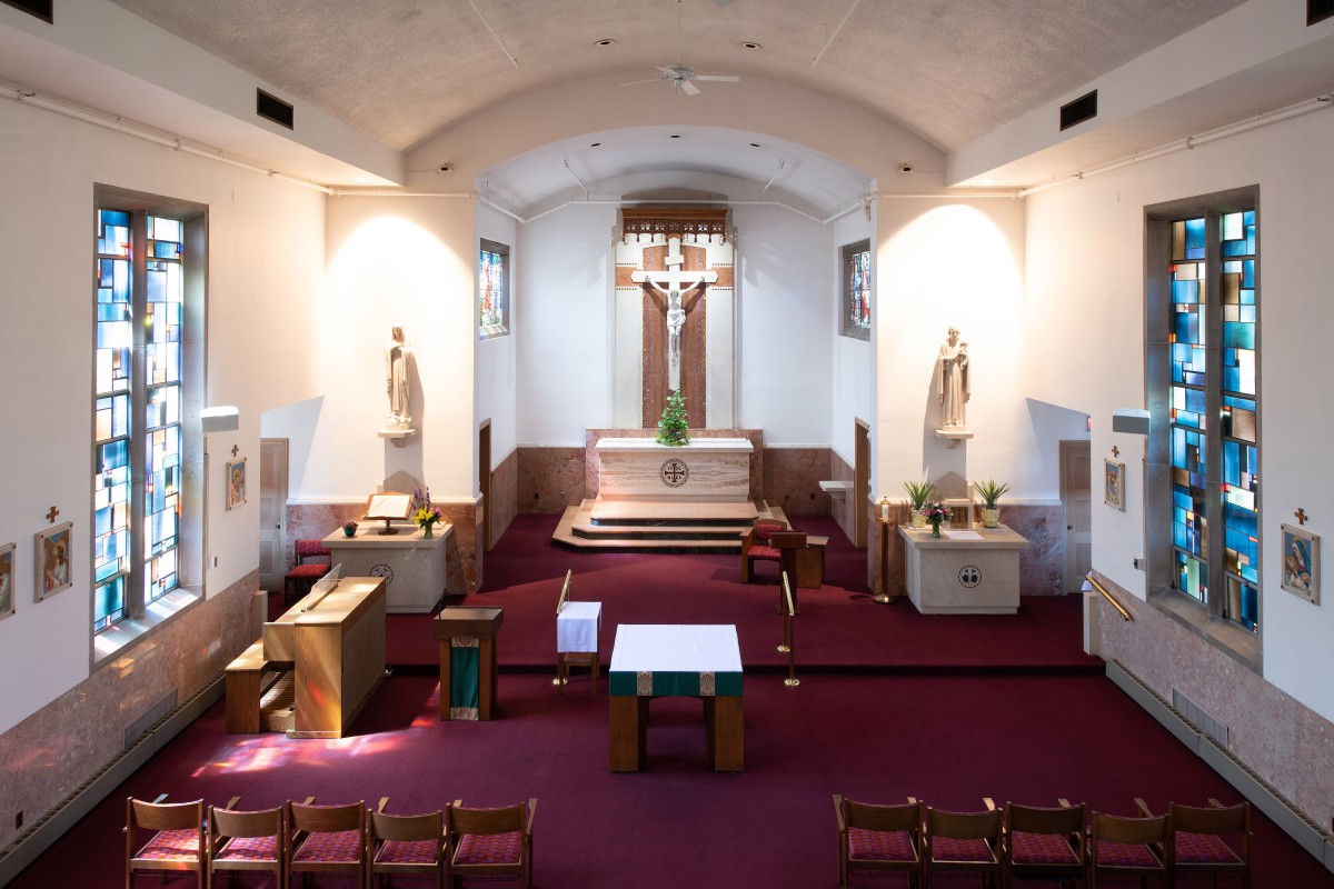 Interior view of a church showing the altar and pews.