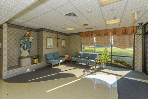 A serene waiting area in a hospital, featuring comfortable seating and ample natural light.