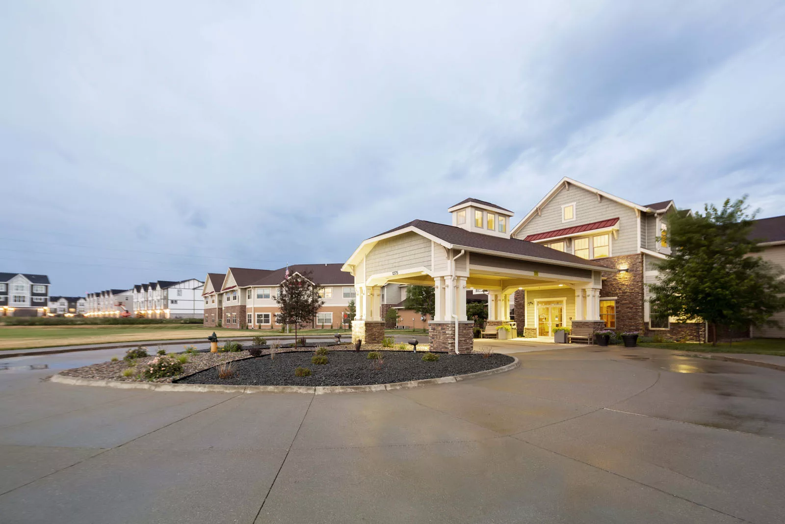 A modern building with a welcoming entrance and driveway.
